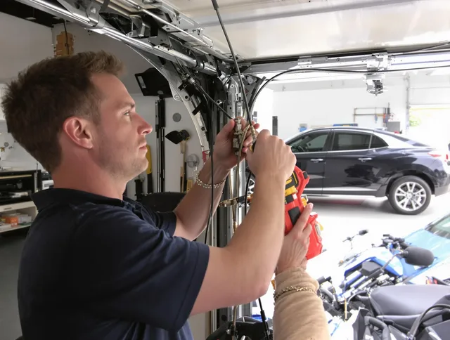 Weddington Garage Door Repair safety certified technician performing cable replacement in Weddington