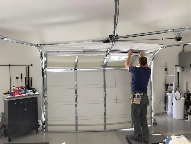 Weddington Garage Door Repair specialist performing precise section replacement on Weddington garage door